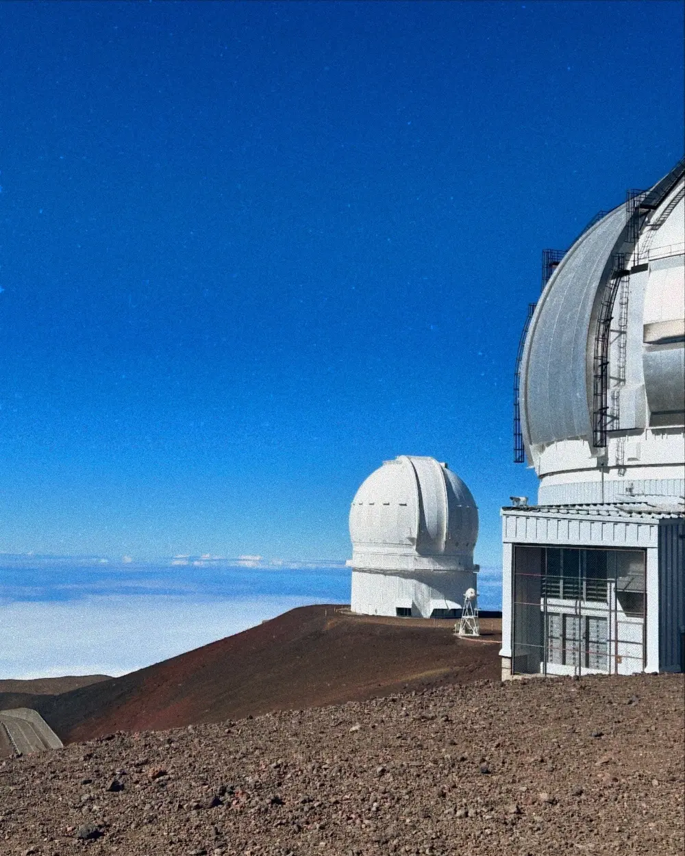Observatory domes above the cloud layer on Maunakea